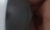 Fingering her pussy while pooping