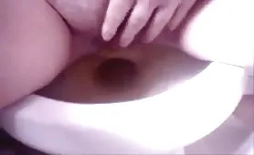 Shaved skinny girl shitting