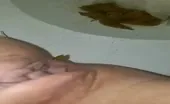 Shaved babe shitting 